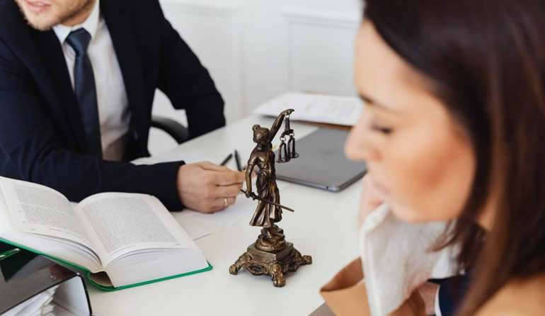 justitia on lawyers desk